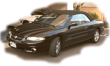 [Front corner view with top up]